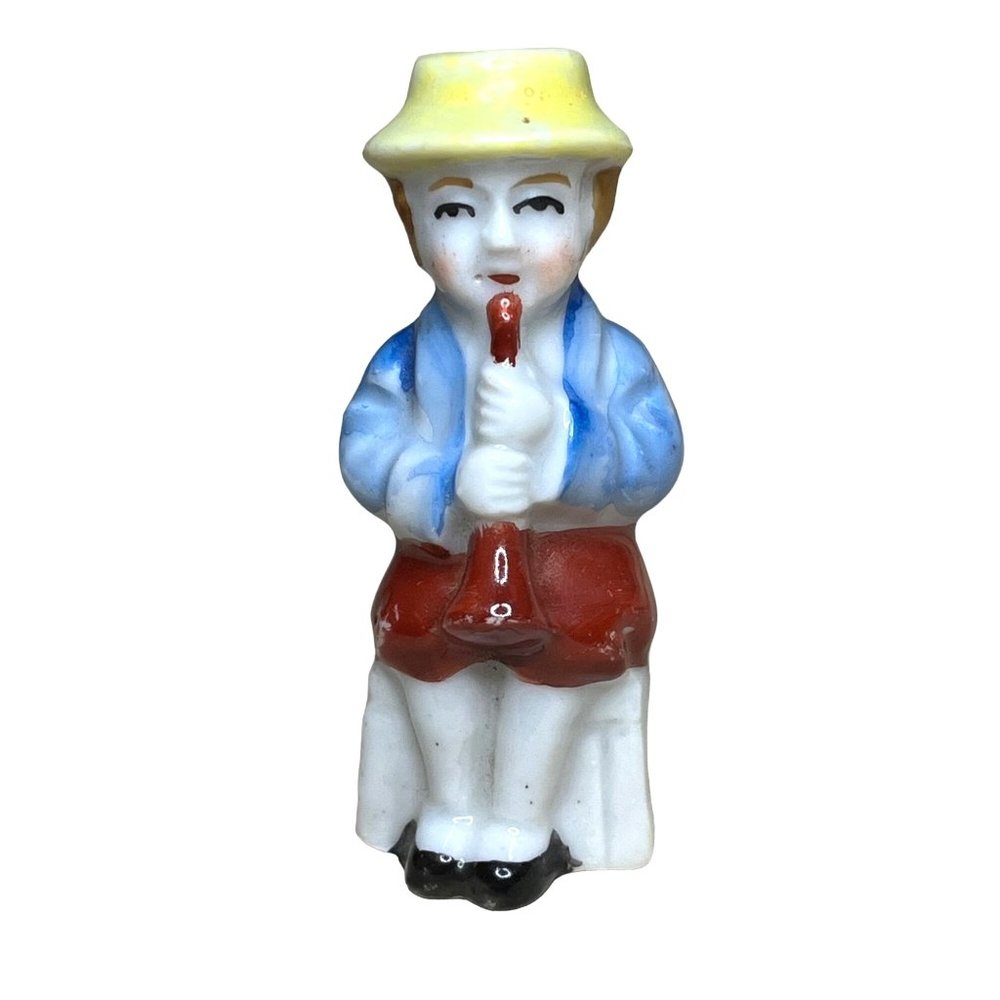 Vintage 1950's Ceramic Figurine Seated Boy with Yellow Hat Playing Horn Occupied